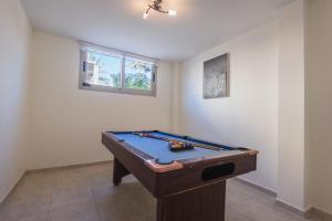 a room with a pool table in a room at Villa 1 Sandy Beach Villas - Heated pool - Jacuzzi - Private Beach Area - Sea Views in Polis Chrysochous