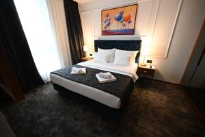 Ένα ή περισσότερα κρεβάτια σε δωμάτιο στο Hotel Tamiš & Spa