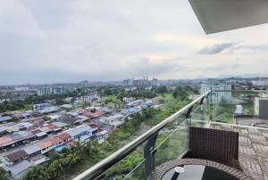 a balcony with a view of a city at Jeff and Ricky Homestay 39 @ Vivacity (Huge Unit) in Kampong Tabuan