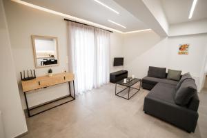 a living room with a couch and a table at Athens Heart Luxury Flat in Athens