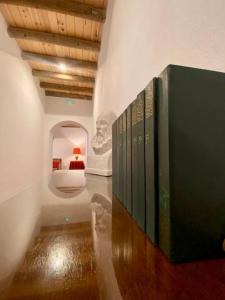 a room with a bunch of books on a wall at Casa del Marqués in Fregenal de la Sierra +108 photos