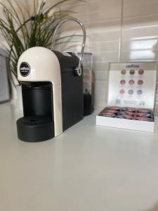 a toaster sitting on a counter next to a box at Allure Apartments in Ohrid