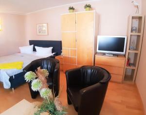 TV a/nebo společenská místnost v ubytování Ostseestrand + 3 fotografie