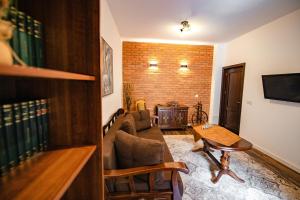 a living room with a couch and a table at Casa Dives - Transylvania in Pianu de Sus