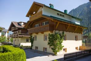 a house in the mountains with a roof at Mountainpeak in Mayrhofen