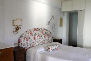 Postel nebo postele na pokoji v ubytování B&B Le Palme