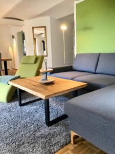 a living room with a couch and a coffee table at Hinners-Hoff Apartments in Bendingbostel
