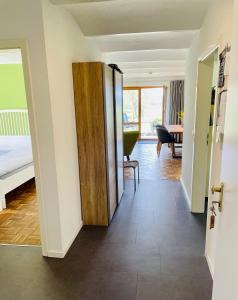a hallway with a door leading to a bedroom at Hinners-Hoff Apartments in Bendingbostel +42 photos