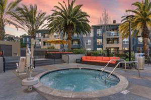 a swimming pool with a couch and a building at Sunnyvale 1br w gym pool wd nr highways SFO-1330 in Sunnyvale