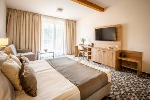Postel nebo postele na pokoji v ubytování Hotel Kaskáda