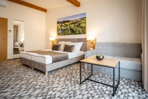 Postel nebo postele na pokoji v ubytování Hotel Kaskáda