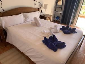 Postel nebo postele na pokoji v ubytování Villa Paula