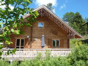 a log cabin with a porch at Chalet Mataya à la Joue du Loup in Le Dévoluy