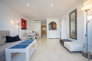 a living room with a couch and a table at Beautiful 2 bedrooms Apartment in Agua Mundo in Benidorm