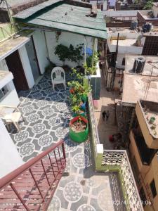 an overhead view of a patio with plants and a chair at Kesher Paying Guest House in Varanasi