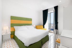 Postel nebo postele na pokoji v ubytování Hotel Bougainville + 37 fotografií