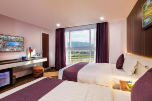 Postel nebo postele na pokoji v ubytování Morris Hotel Nha Trang + 55 fotografií