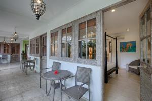 a dining room with a table and chairs at OK Divers Resort & Spa in Padangbai