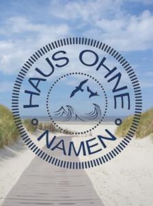 un cartello per noi oceanici nuovi waveemen sulla spiaggia di Haus ohne Namen Juist a Juist