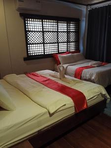 Letto o letti in una camera di Miley Lodging Restobar
