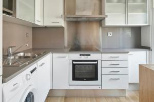 A kitchen or kitchenette at Mirakruz Terrace by FeelFree Rentals