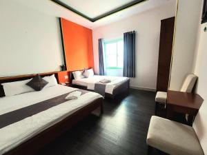 Postel nebo postele na pokoji v ubytování Nam Anh 2 Hotel