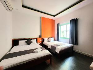 Postel nebo postele na pokoji v ubytování Nam Anh 2 Hotel