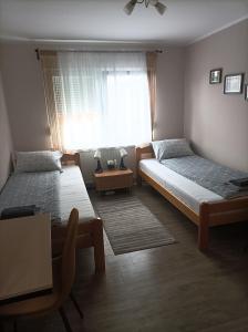 Postel nebo postele na pokoji v ubytování ARIANA apartman