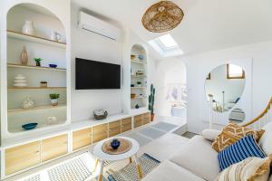 Televízia a/alebo spoločenská miestnosť v ubytovaní Casa Belvedere - duplex atypique avec vue féerique & parking souterrain