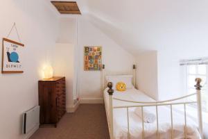 a small bedroom with a bunk bed and a dresser at Welcome to Port Isaac - Padstow - Polzeath in Saint Teath