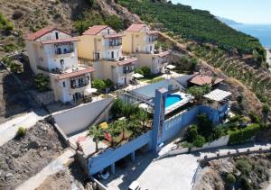 an aerial view of a house on a mountain at Blue Lagoon Village in Gazipasa