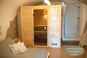 a room with a wooden closet with a shower at Villa Letná in Brandýs nad Labem-Stará Boleslav