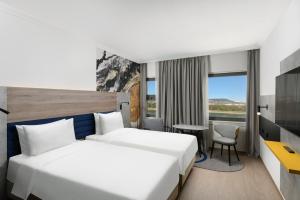 Postel nebo postele na pokoji v ubytování Danubius Hotel Helia