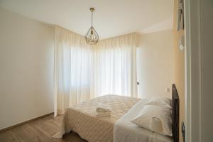 A bed or beds in a room at Tenuta dei Franceschi