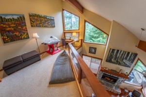 an overhead view of a living room with a slide at Snowy Creek 04 - Ski In Ski Out, Private Hot Tub, Short Walk to Whistler Village in Whistler