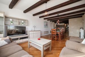a living room with a couch and a table at Villa Vita in Benkovac