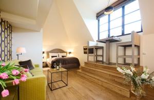 a living room with a couch and a bed at Burg Reichenstein in Trechtingshausen