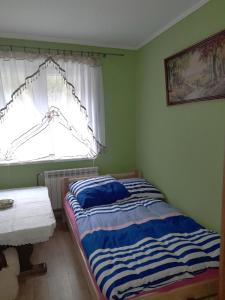 Кровать или кровати в номере Noclegi u Barbary