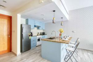 Kuchyň nebo kuchyňský kout v ubytování The Smart Concierge - Greens