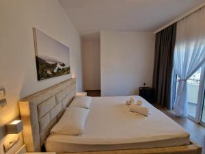 Postel nebo postele na pokoji v ubytování Hotel Queen Margaret Seaside