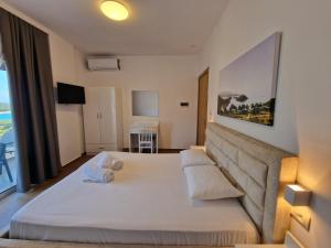 Postel nebo postele na pokoji v ubytování Hotel Queen Margaret Seaside