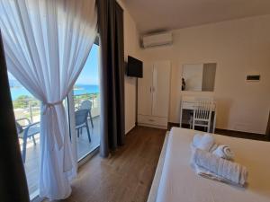 Postel nebo postele na pokoji v ubytování Hotel Queen Margaret Seaside
