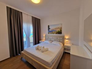 Postel nebo postele na pokoji v ubytování Hotel Queen Margaret Seaside