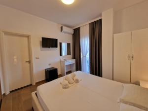 Postel nebo postele na pokoji v ubytování Hotel Queen Margaret Seaside
