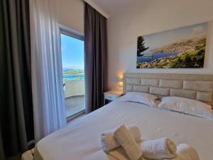 Postel nebo postele na pokoji v ubytování Hotel Queen Margaret Seaside