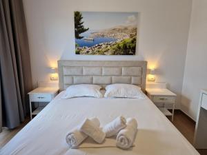 Postel nebo postele na pokoji v ubytování Hotel Queen Margaret Seaside