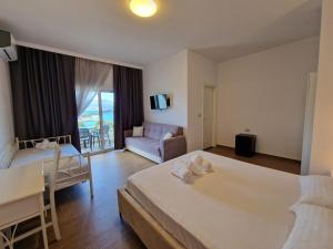 Postel nebo postele na pokoji v ubytování Hotel Queen Margaret Seaside
