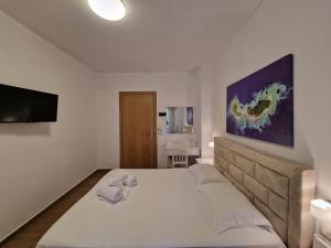 Postel nebo postele na pokoji v ubytování Hotel Queen Margaret Seaside