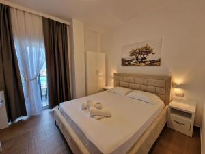 Postel nebo postele na pokoji v ubytování Hotel Queen Margaret Seaside