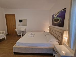 Postel nebo postele na pokoji v ubytování Hotel Queen Margaret Seaside